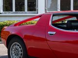 a red car that is parked in front of a building