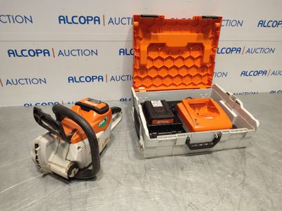 a couple of chainsaws sitting on top of a hard case