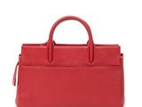 a red leather handbag on a white background