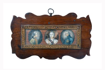 a picture of a picture of three people hanging on a wall
