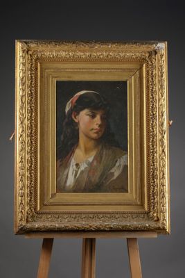 a painting of a woman with a red headband on an easel
