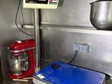 an image of a kitchen with a scale and a mixer