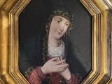 painting of a woman with a crown of thorns in a gold frame
