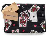 a black purse with playing cards and a tag on it