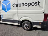 a white van that is parked on the side of the road