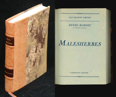 two books that are sitting side by side on a table