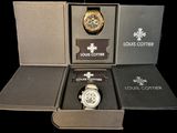 a box with a watch inside of it on a black background