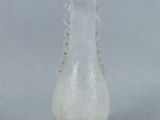 an image of a glass vase on a gray background