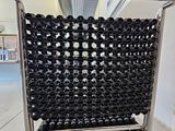 a shopping cart that has a lot of bottles in it