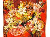 an image of a red and yellow floral tapestry hanging on a wall