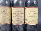 three bottles of wine sitting next to each other on top of a table