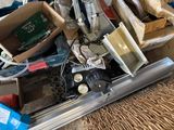 a pile of assorted items sitting on the floor
