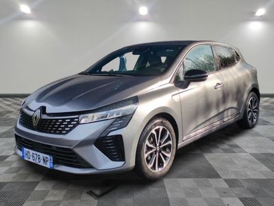 a silver car is parked in a room with a checkered floor