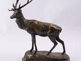 bronze sculpture of a stag on a marble base