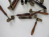 a lot of different types of brass pipes on the table