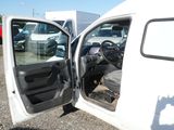 a white truck with its door open and the driver ' s seat down