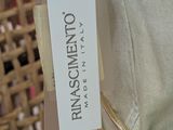 a label on the back of a dress hanging on a mannequin