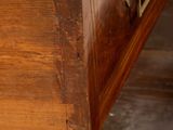 a close up of a drawer on a wooden table