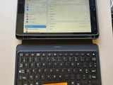 a laptop and a tablet on a table with a price tag on it