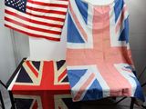 two british and american flags hanging on a wall