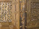 a large wooden cabinet with intricate carvings on it