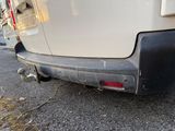 a white van that is parked on the side of the road