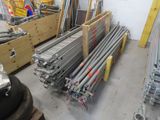 many different types of metal pipes in a warehouse