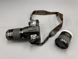 a camera and a lens on a table