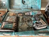 a blue tool case with tools in it on a table