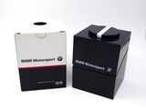 two boxes of bmw motorcycles are sitting side by side on a white surface