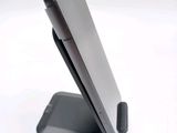 a cell phone that is sitting on top of a stand