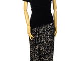 an image of a mannequin dressed in a black and gold dress