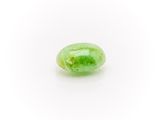 a green jade stone on a white background