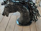 a sculpture of a horse and a cheetah on a porch