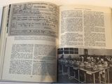 an open book with a picture of a group of people sitting at a table