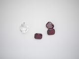 three pieces of garnets are shown on a white surface