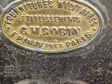 an old sewing machine with a brass plate on it