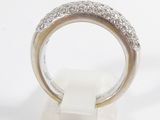 an image of a diamond ring sitting on top of a white marble block