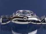 a close up of a watch on a glass surface