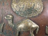 a close up of a vase with animals on it