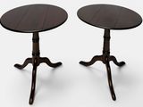 a pair of tables with a wooden top and two legs
