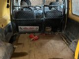 a yellow van that has two seats in it