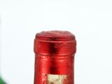 a close up of a bottle of wine on a table