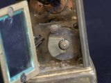 a small clock that is sitting on a table