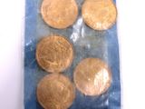 a bag of gold coins sitting on top of a table