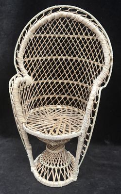 an image of a wicker chair on a black background