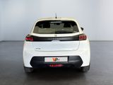 the rear end of a white car in a white room