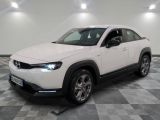 the white mazda cx - hr suv is parked on a checkered floor