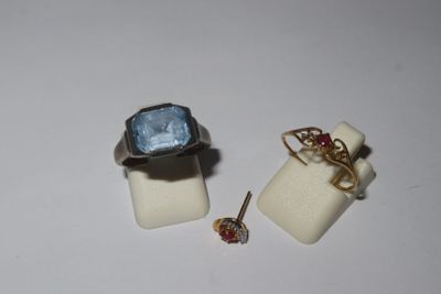 two rings that are sitting next to each other on a white surface