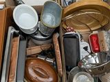 a box full of assorted kitchen items sitting on the floor